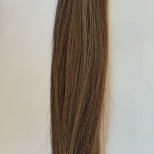 A close-up of Joli straight, light brown hair with subtle highlights, shown against a plain white background.