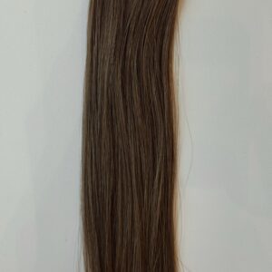 A long, straight lock of Lexi medium brown hair against a plain, light-colored background.